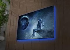 Wallity Obraz s LED osvetlením ASTRONAUT VO VESMÍRE II 45 x 70 cm